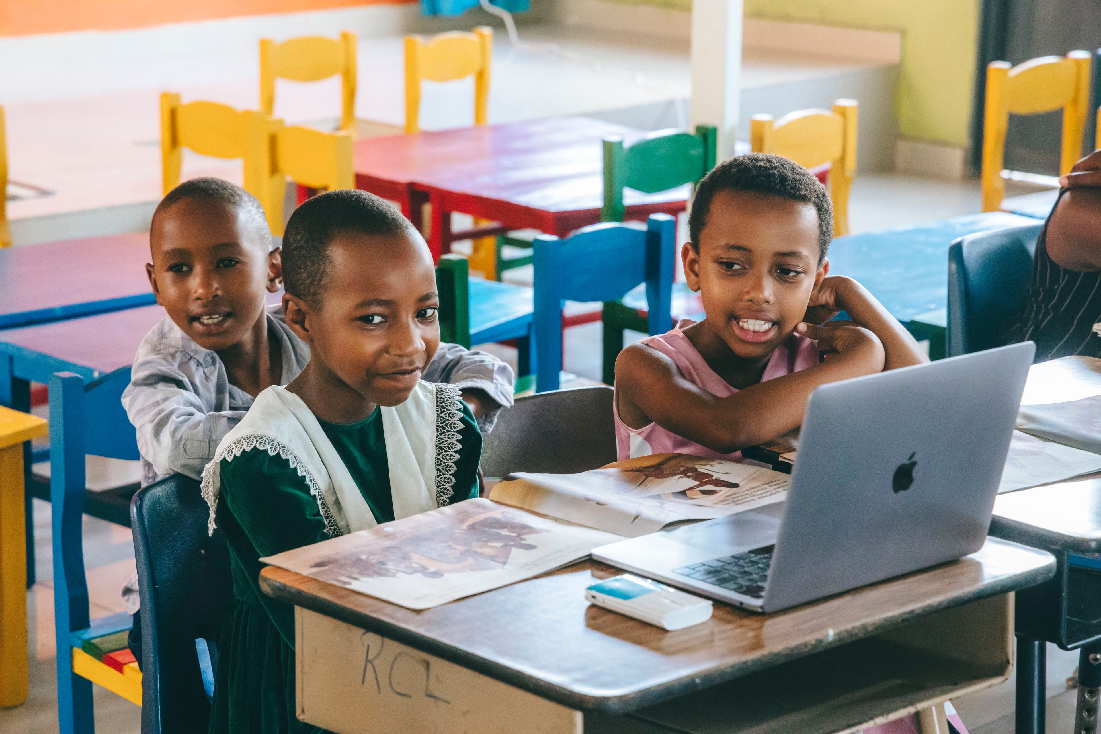 Young Students using SomaBox and reading a book