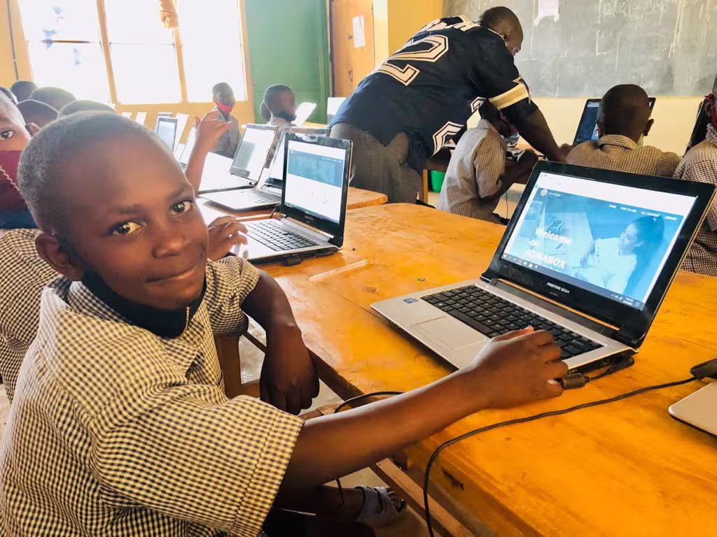 Happy Students Using SomaBox on a laptop