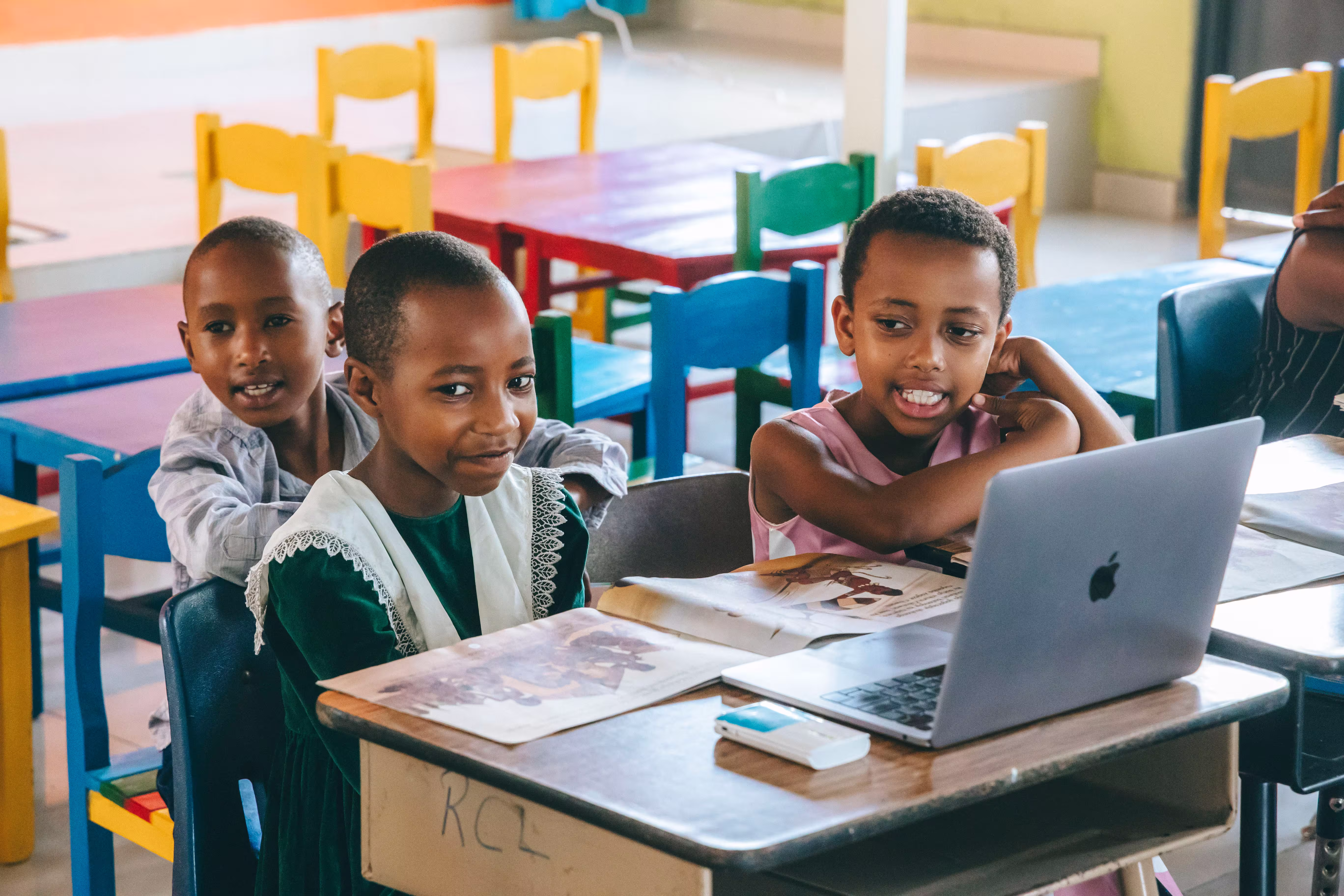 Young Students using SomaBox and reading a book